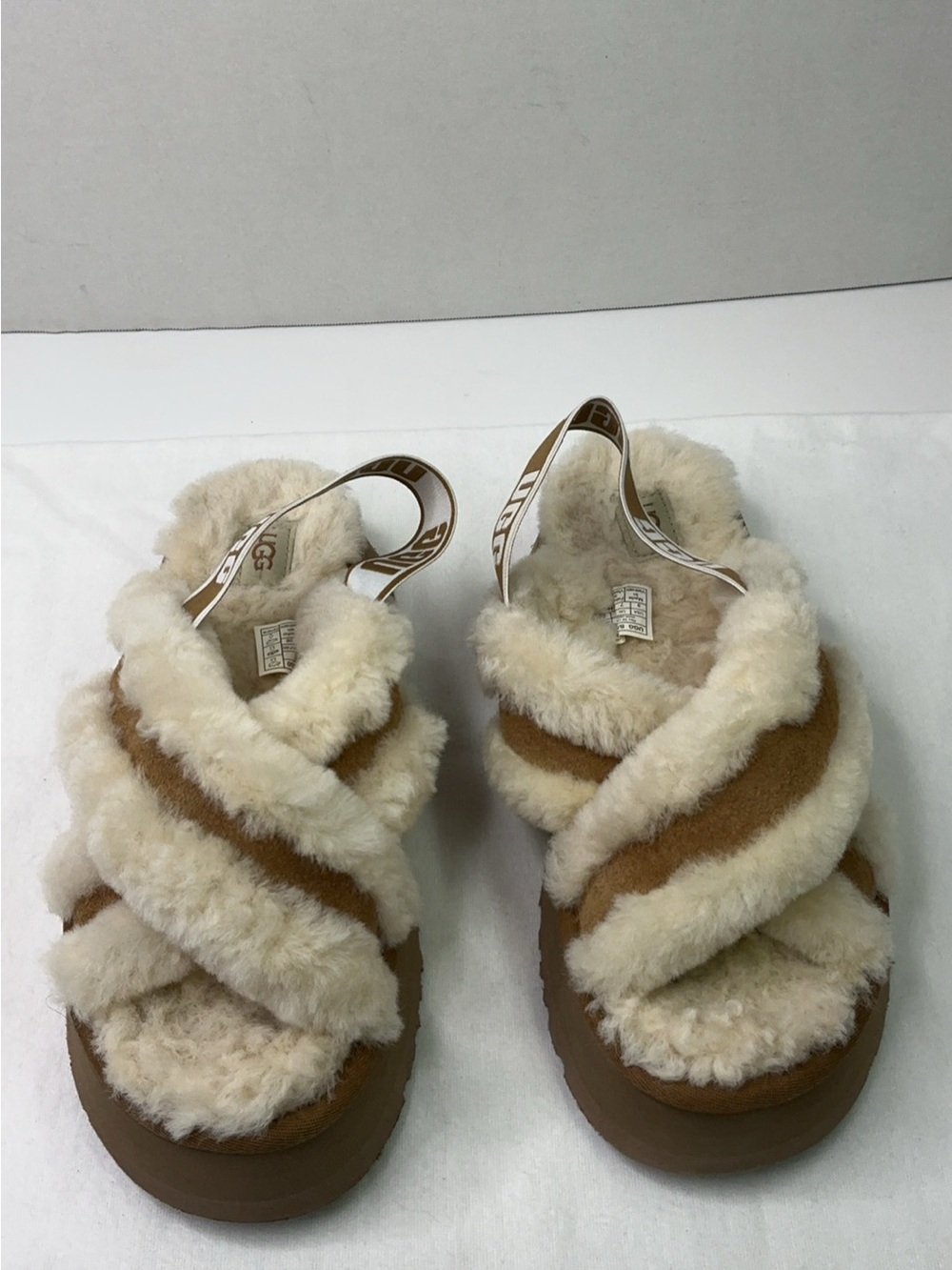 UGG Disco Cross Slide slippers in a beige color, size 9.